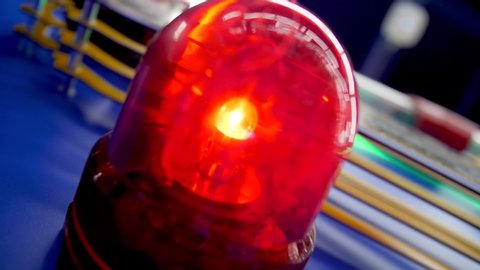 Closeup 4k video of rotating red emergency alerm light in fire department or police station