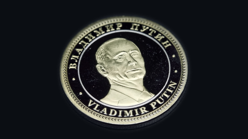 Russian souvenir coin Vladimir Putin rotates on a black background. Macro. Closeup
