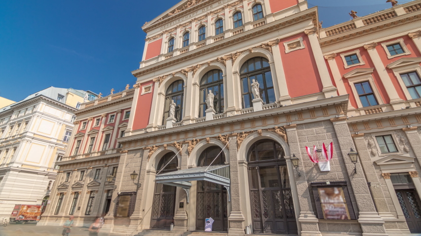 The Wiener Musikverein timelapse hyperlapse (Viennese Music Association) is a famous Vienna concert hall. It was built in 1870. Front view with blue sky