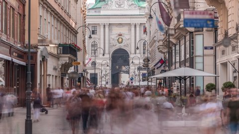 Kohlmarkt street with Hofburg Complex timelapse in downtown of Vienna in Austria with crowd in the street. Many caffes and shops around