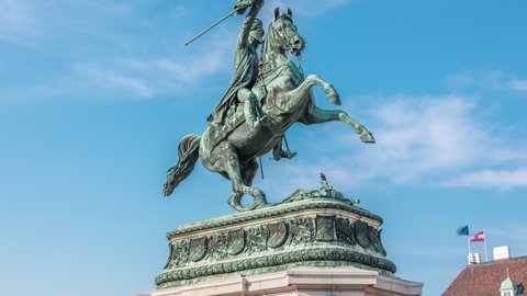 Statue rider Erzherzog Karl ( Archduke Charles) on horseback with flag in hand timelapse. Heldenplatz (Heroes' Square). Vienna (Wien). Austria