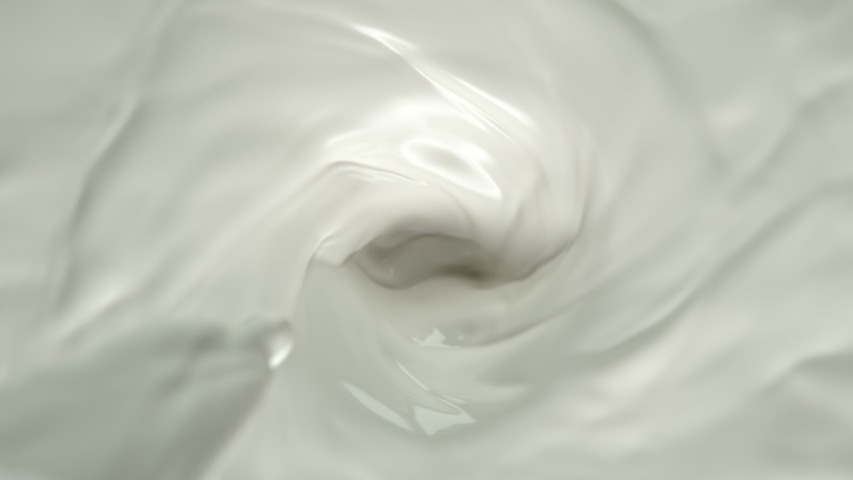 Super Slow Motion Shot of Pouring Milk into Fresh Cream Vortex at 1000 fps. Royalty-Free Stock Footage #1043273725