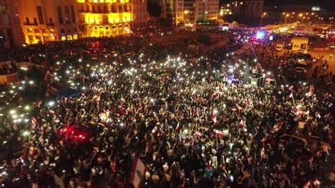 Beirut, Lebanon 2019 : night drone shot of Martyr square, during the Lebanese revolution, with thousands of protesters revolting against government failure and corruption