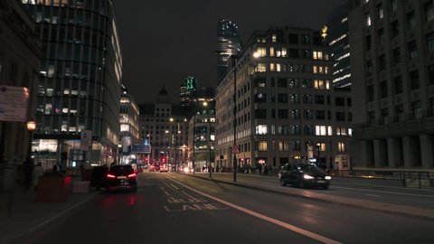 London, United Kingdom-10.10.2019: Moving rolling shot of a Mercedes E-Class car driving on London city centre streets at night 