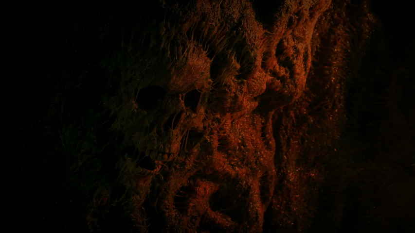 Skull In Cave Wall Lit Up In Fire Light Royalty-Free Stock Footage #1043321605