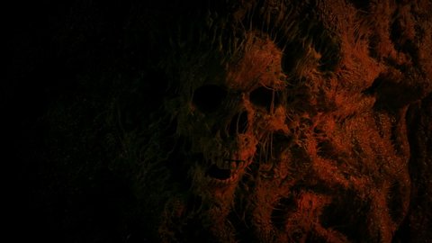 Skull In Cave Wall Lit Up In Fire Light
