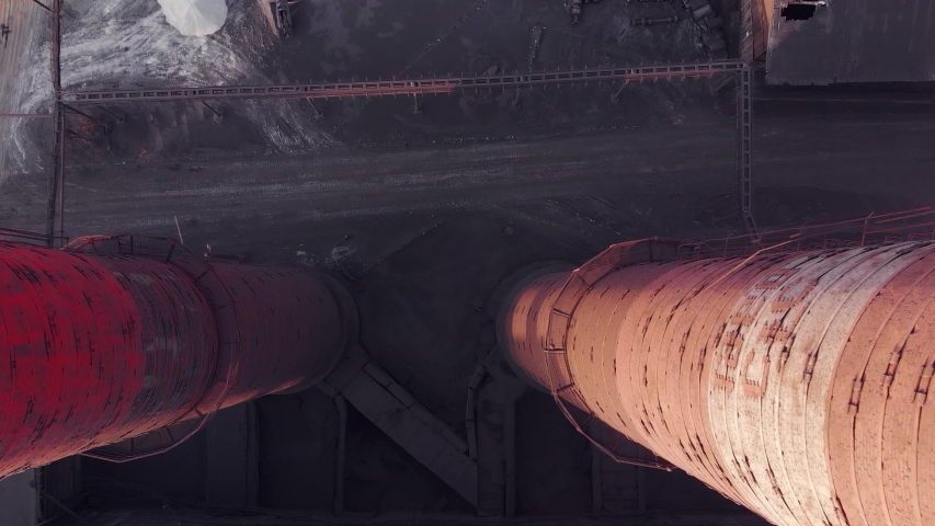 Epic aerial of high smoke stack with red emission. Plant pipes pollute atmosphere. Industrial factory pollution, smokestack exhaust gases. Industry zone, thick smoke plumes. Climate change, ecology Royalty-Free Stock Footage #1043331121