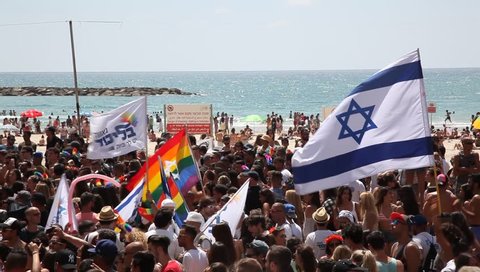 TEL AVIV, ISRAEL - JUNE 12, 2015: Gay, Lesbians, Bisexuals, Transgenders and their fans march along the beach during the Gay Pride Parade Festival in Tel Aviv.