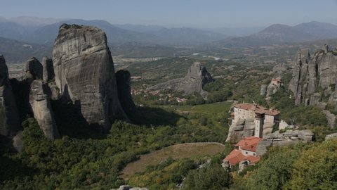 Kastraki village and Saint Nicholas of Anapafsas monastery on Meteora rocks 4K panning footage