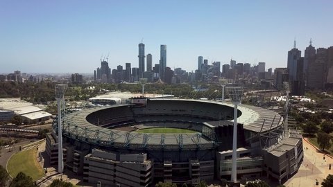 Melbourne, Victoria / Australia - December 22 2019: Drone aerial view of Melbourne CBD looking over the Melbourne Cricket Ground
