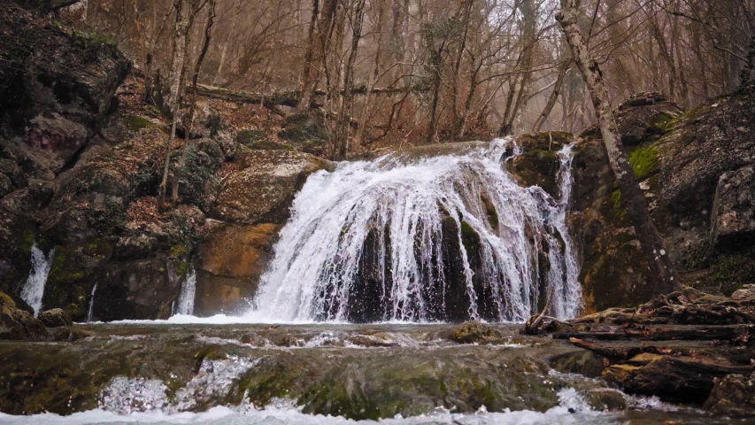 Flowing water over stones in mountines river
