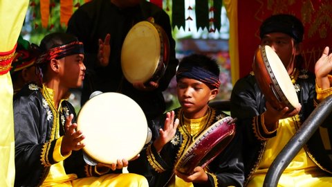 Tarakan/Indonesia-12212019: Group of musician play rebana or also known as kompang, performing in 
Nusantara cultural parade on Dec, 21 2019 in Tarakan, Indonesia.