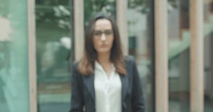 Attractive business woman with eye glasses smiling portrait. Young business people confident pretty. Growing, success. 4K slow motion video
