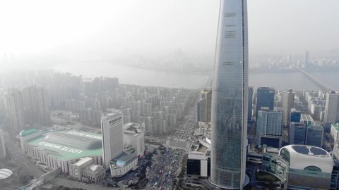 SEOUL, SOUTH KOREA - MARCH 29, 2018: Lotte World recreation complex, hotel, supertall skyscraper and shopping mall, aerial shot. Landmarks of Seoul city from air