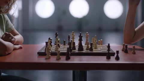 Black and white wooden chess on a playing board. 
Low contrasted image ready for colour grading.
Arri Alexa Mini Shooting