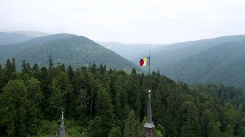 4K Romanian Flag Drone Aerial Peles Castle Romanian Mountains Transylvania