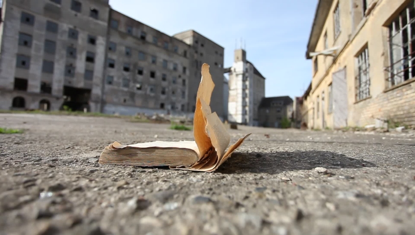 old book pages in lost place turned by the wind