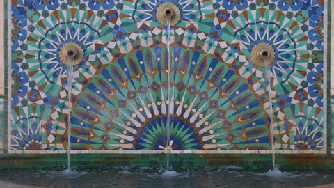 Beautiful fountain at the mosque Hassan II, water tap decorated with colorful shapes of mosaic - Casablanca, Morocco