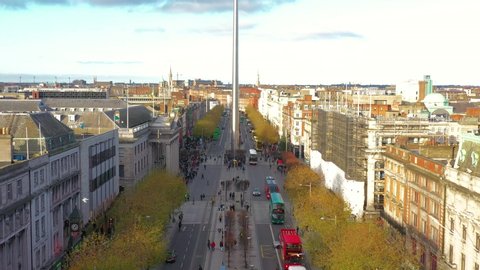 aerial view of city center of Dublin with Spire of Dublin, cars, buses and people on the street 