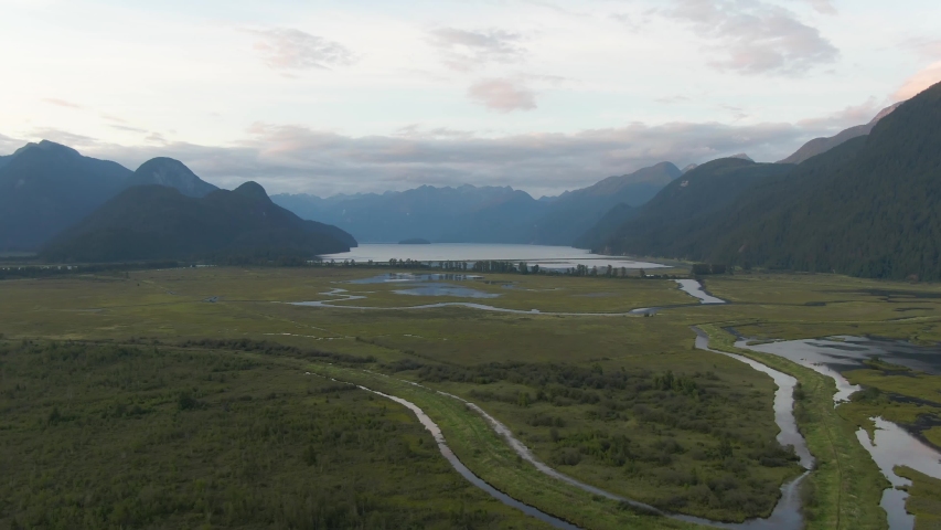 Beautiful Aerial Panoramic View of Canadian Mountain Landscape during a vibrant summer sunset. Taken near Pitt Lake, Near Vancouver, British Columbia, Canada.