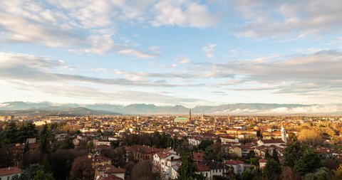 Aerial view of the city of Vicenza in Italy at sunset. The city of Palladio, from the name of the architect who designed most of his works here in the late Renaissance. Sky clearing after a rainy day.