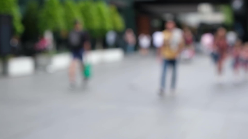 POV walk through blurred people on the streets of Melbourne in slow motion