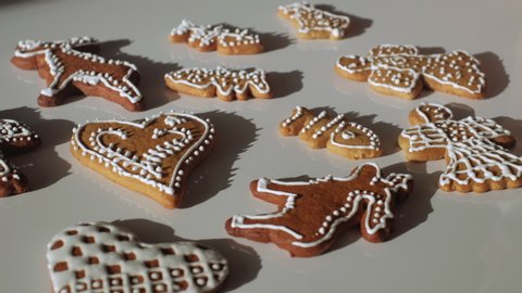 Traditional gingerbread Christmas cookies being displayed and decorated. Trucking shot. Czech Republic