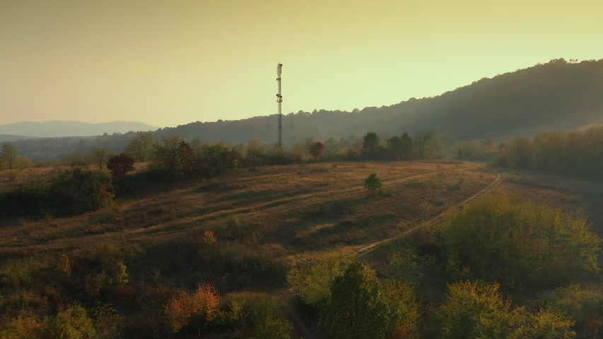 Communication tower on the hill top in fall season