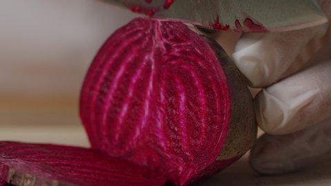 Cutting beet with sharp chef knife macro shot, cooking process, preparing ingredients for Tar Tar, slow motion, shot on Red Weapon Helium