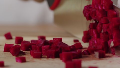 Cutting beet with sharp chef knife macro shot, cooking process, preparing ingredients for Tar Tar, slow motion, shot on Red Weapon Helium