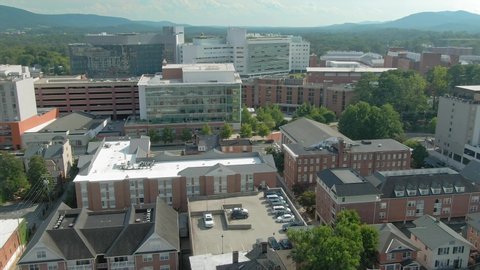 Aerial: establishing shot of the the city of Charlottesville, Virginia, USA