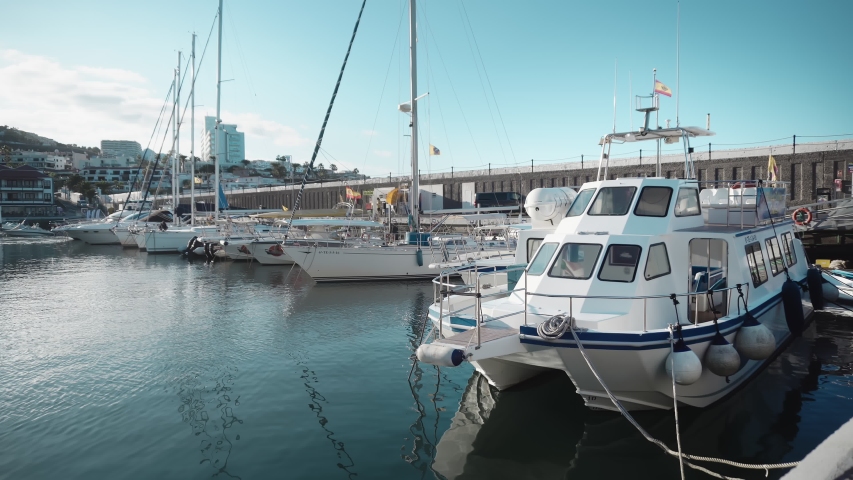 Gorgeous view of boats standing on park in southern town marina in hilly region