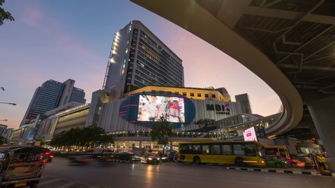 Bangkok , Thailand -  30 Oct, 2019 : Day to night time lapse a lot traffic at front side MBK shopping center