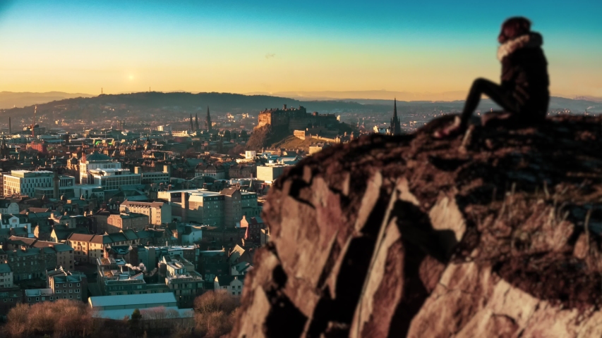 A Girl Overlooking The Beautiful Edinburgh Skyline And Castle During A Winter Sunrise