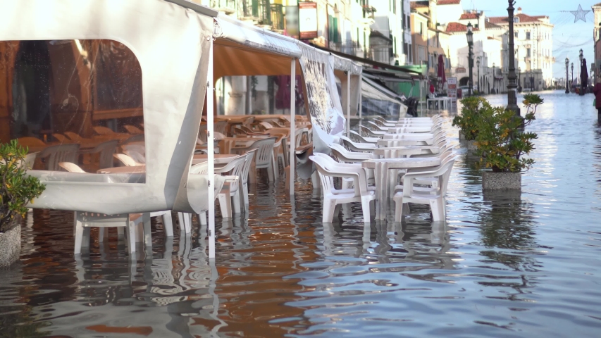 Bar chairs and tables in the flooded city