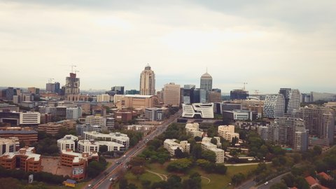 View of central Sandton, Johannesburg. The clip includes some of the major Sandton buildings and shows Johannesburg CBD at the end.