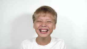 Closeup view portrait of young happy cheerful kid celebrating his success performing silly dance of winner. Real time 4k video footage.