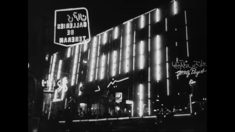 CIRCA 1960 - Neon lights burn bright in an Iranian city.