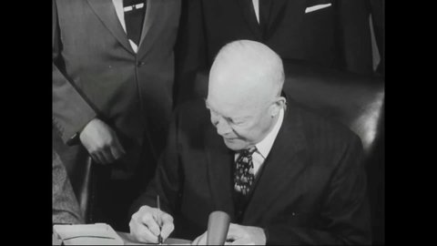 CIRCA 1950s - A helicopter lands at the White House and President Dwight Eisenhower is shown signing a document at a press conference.