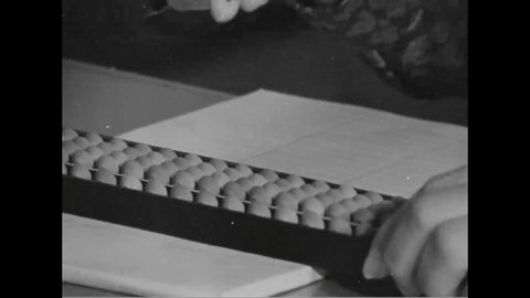 CIRCA 1960s - Women in sales use different calculating machines, including an abacus, on the Ryukyu Islands.
