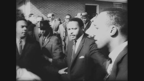 CIRCA 1965 - Martin Luther King regroups with his team after the violent disturbance in Selma.