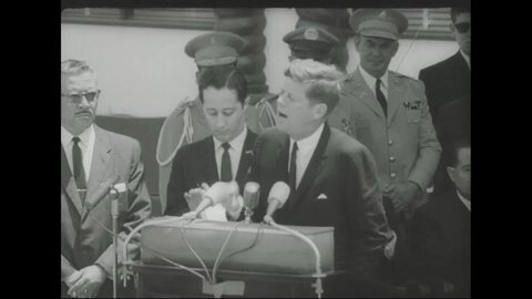 CIRCA 1963 - JFK arrives in San Jose, where he is met by huge crowds and President Orlich. He makes a short speech about unifying the Americas.