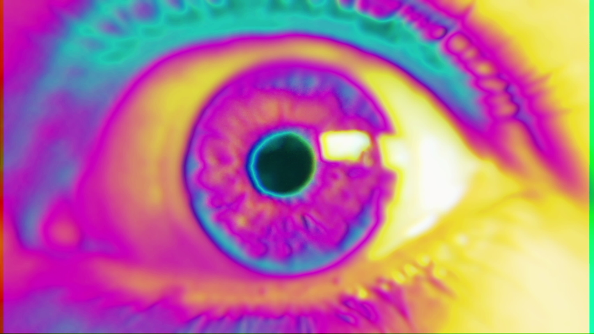 Psychedelic Eye Multicolored Glitch. Extreme close up of an wide opened eye in a psychedelic effect. Royalty-Free Stock Footage #1043536255