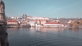 Scenic cinematic slow motion video of panorama with Prague Castle (Prazsky hrad), Charles bridge (Karluv most) and Vltava river in capital of Czech Republic Prague.