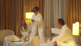 Family in hotel room, little son play with virtual reality glasses - Powered by Shutterstock - Get 15% off with code: PIKWIZARD15