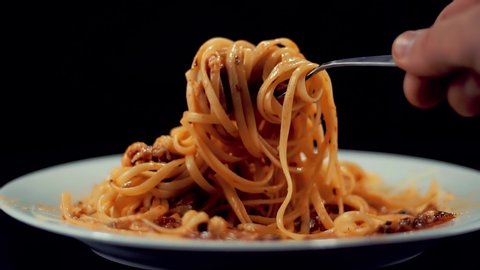 Man Eat Pasta Italian With Sauce Bolognese. Spaghetti,Tomato And Parmesan. Italian Carbonara Cuisine In Restaurant Eating Pasta Bolognese. Chef Tasting Spaghetti Marinara Sauce. Delicious Italian Food