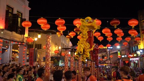 Dancer of lion dance jumps up high 120fps slow motion during chinese new year celebration DEC 27 Melaka, Malaysia 2019