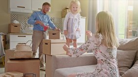 Active Family Group Move in Rent Real Estate. Positive Looking at Relocating or Unpacking of Carton Pack by Playful Family. Little girl jumps on hands to mom. Enjoying Life or Dream of Small Child by - Powered by Shutterstock - Get 15% off with code: PIKWIZARD15