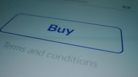 Close-up Macro Shot: Touch Screen Device with Open Application Showing "Buy" Button, Finger Pushes / Presses the Button it Flashes with Blue Light. Online Shopping / E-commerce Concept. Mock-up App - Powered by Shutterstock - Get 15% off with code: PIKWIZARD15