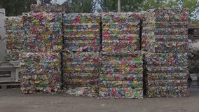 Compacted and compress aluminum  waste in a cube ready for recycling. Cans for recycling. Ecological conscience